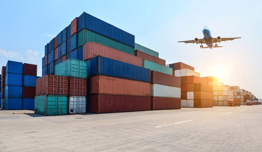 Shipping containers stacked at a busy port